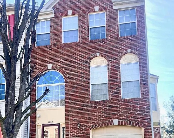 Closed brick end-unit townhome exterior