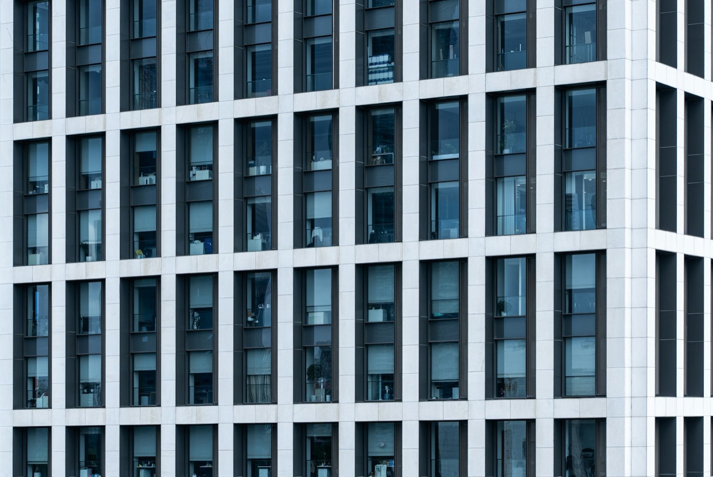 Modern commercial office building facade with a geometric grid of windows
