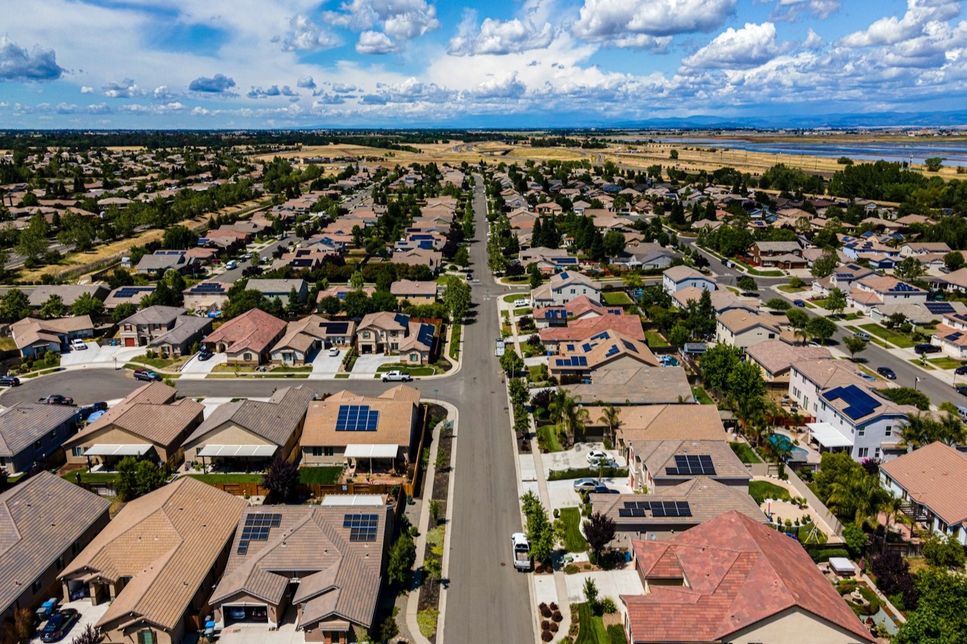 Aerial view of an established residential neighborhood illustrating home, street, and location considerations